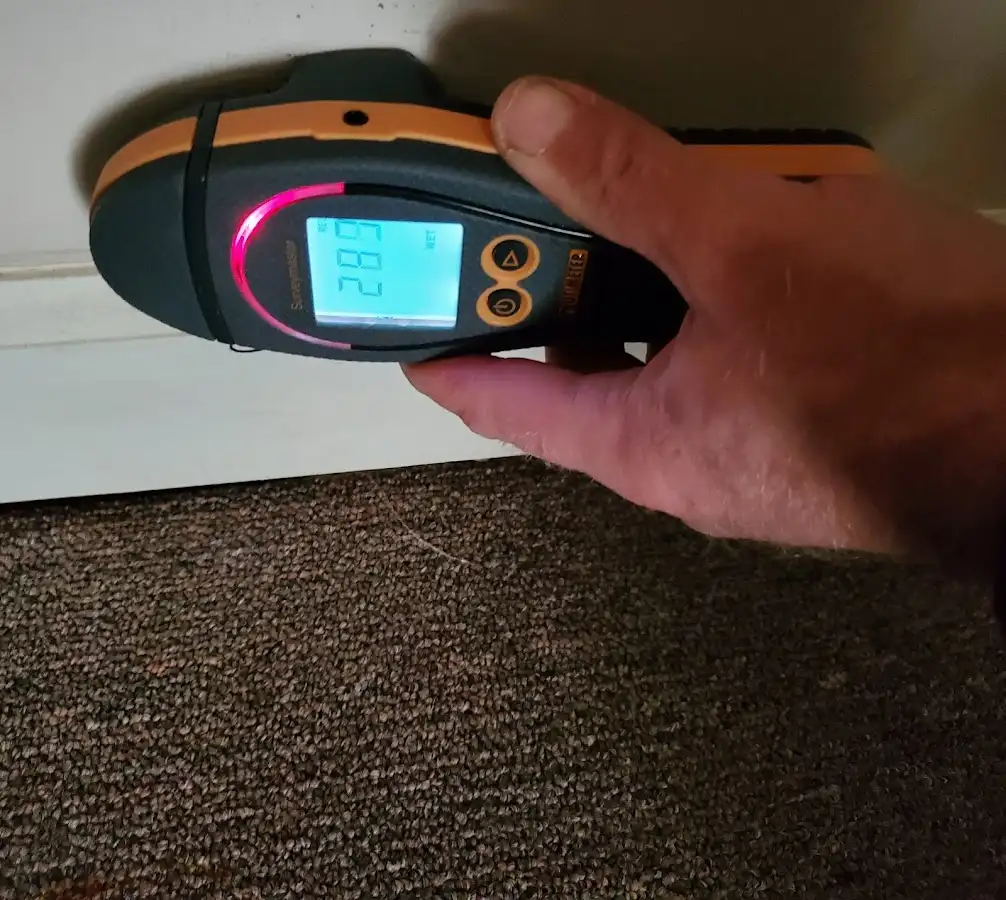 Moisture detection at baseboard during Sewage Cleanup & Sanitation in Blackwell